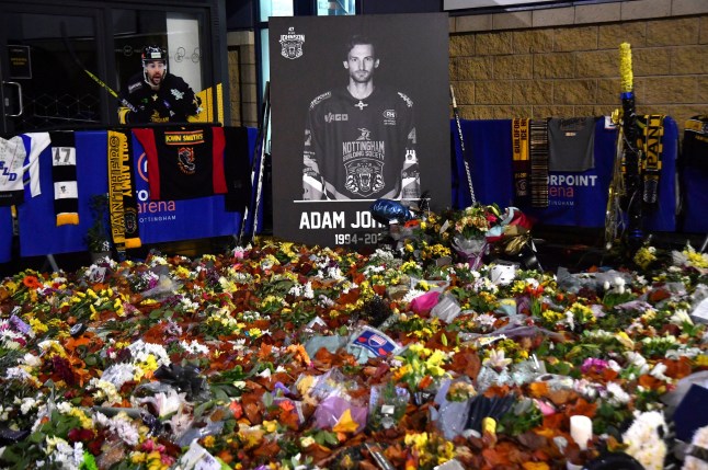 Flower tributes for Nottingham Panthers Adam Johnson outside the Motorpoint Arena before the Ice Hockey Adam Johnson memorial game between Nottingham Panthers and Manchester Storm in Nottingham, England, Saturday, Nov. 18, 2023. The memorial game is held three weeks after Adam Johnson, 29, suffered a fatal cut to his neck during a game against Sheffield Steelers on Saturday, Oct. 28, 2023. (AP Photo/Rui Vieira)