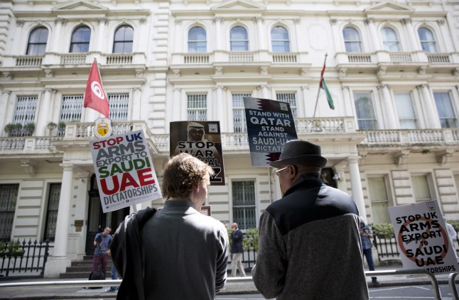 LONDON, UNITED KINGDOM - JUNE 17 : People hold placards during a protest against the Saudi-UAE led aggression on Qatar in an emergency protest called by the international campaign for Justice & Peace outside the United Arab Emirates Embassy in London, United Kingdom on June 17, 2017. (Photo by Isabel Infantes/Anadolu Agency/Getty Images)
