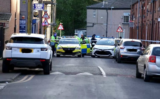 Police at the scene on Ashfield Road, Rochdale on Monday (Picture: JMG Press)