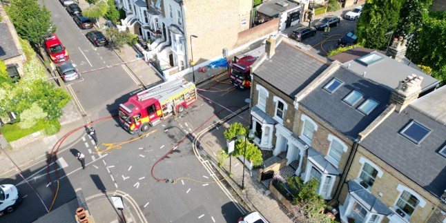 17/06/35 Pictured: emergency response, police and fire service at the scene of gas explosion in Stoke Newton today Caption: Authorities are investigating the cause of a suspected gas explosion at a home in north-east London. Six fire engines and 40 firefighters were called to the scene on Dumont Road in Stoke Newington shortly before 5am on Tuesday.